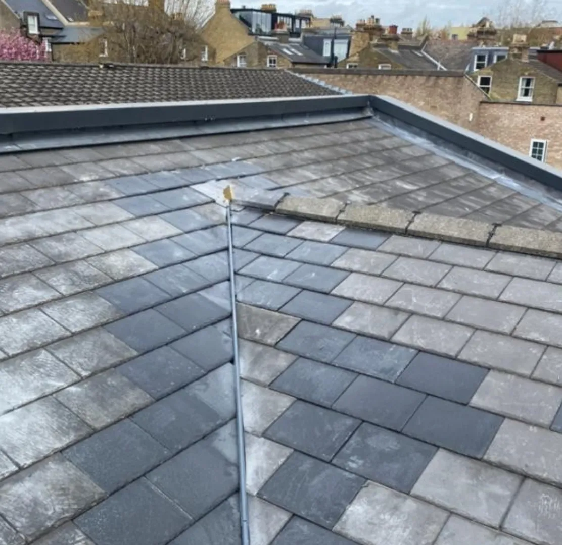 Newly slated hipped roof with parapet detail