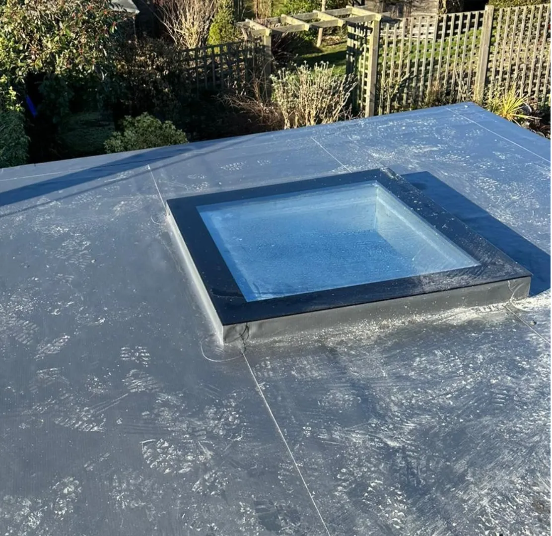 Single ply flat roof with square rooflight